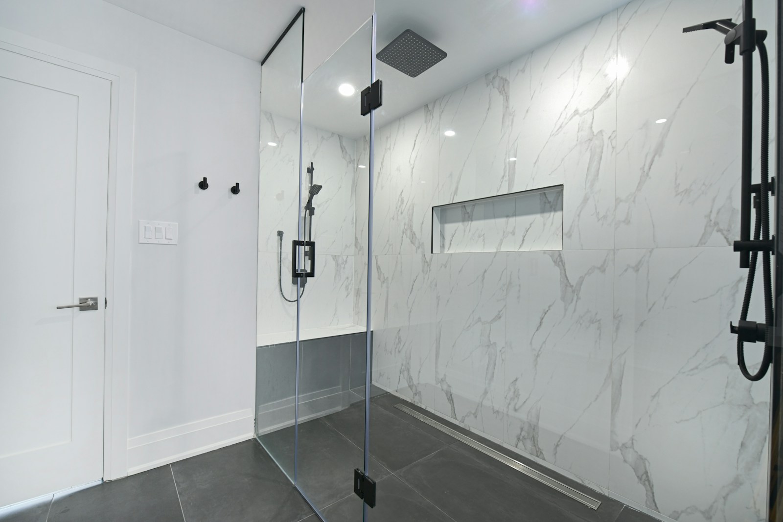 Frameless glass shower enclosure in a modern bathroom